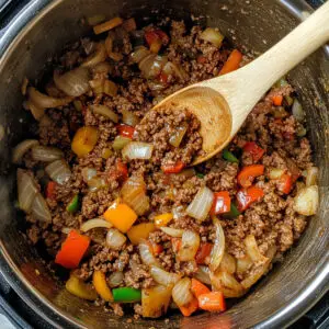 Instant Pot on sauté mode with ground beef browning