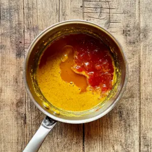 saucepan filled with BBQ sauce ingredients