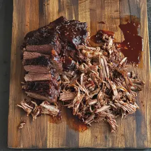 chuck roast resting on a rustic wooden board