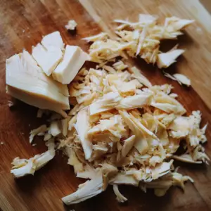 chunks of canned jackfruit on a wooden cutting board