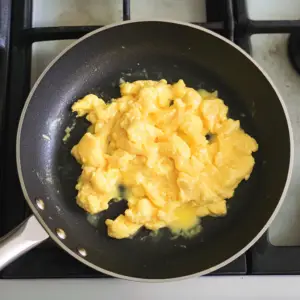 fluffy scrambled eggs cooking gently