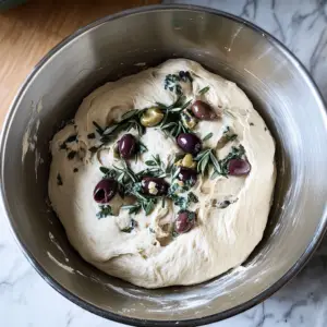 sourdough bread dough in a stainless mixing bowl