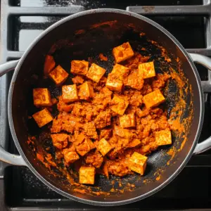 tofu cubes coated in a small amount of Massaman curry paste