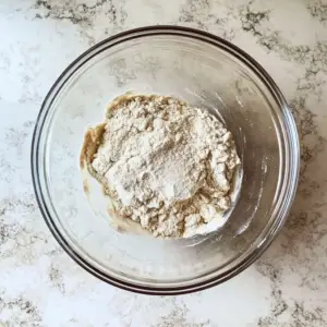whole wheat flour and water, partially mixed