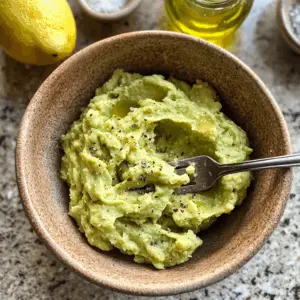 mashed avocado that is creamy with visible small chunks