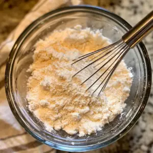mixing bowl with dry ingredients on a clean kitchen counter