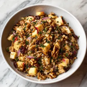 Warm Apple Cranberry Farro Salad with herbs
